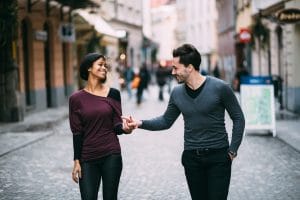 Couple walking on a date in Paris
